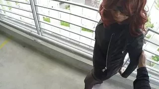 Redhead MILF in leather outfit gets fucked in public parking lot and filled in standing creampie