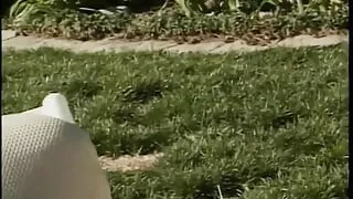 Guy with a ponytail doggy fucks a cute girl with no tits in backyard