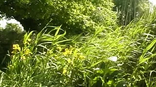 A slim blonde beauty from France gets two hard cock outdoors