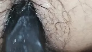 He touches my pussy and fingers my ass slowly, inserting a black dildo into me to make me feel a lot of pleasure