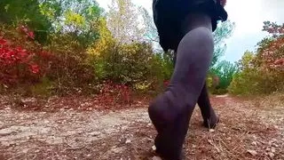 Follow my footsteps along the path in the evening lonely forest