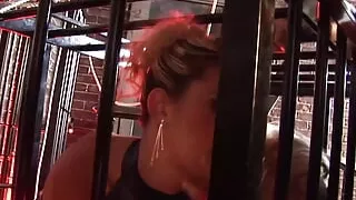 A superb group sex action with a sexy blonde locked up in a cage