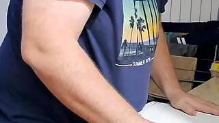 sexy bearded guy makes a dishwasher for him to rub his cock