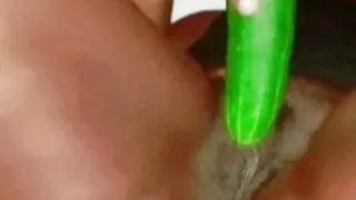 Tight girl masturbating with cucumber