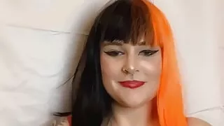 Big tiddy goth gives a tit wank