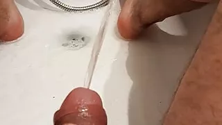 I piss my warm urine and jerk my cock