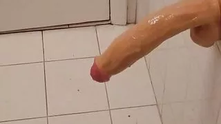 Big Latina with her 12 inch bathroom dildo fun