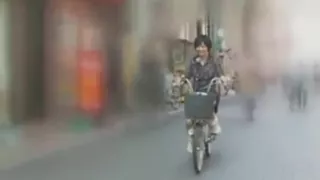 03541 Acme in agony on bicycle