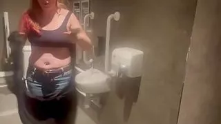 Stepmom joins horny stepson in cinema toilet to help release his big build up flashes him and sucks his Cock