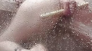 Dildo fucking my pussy while the water blasts my clit