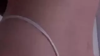 The girl touches hers and shakes her ass