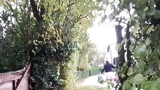 In a pink maid's outfit to go carry the trash can