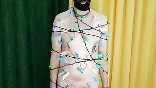 Dominatrix Nika and her Christmas tree. Slave gets some pain, nipple play, body clamps