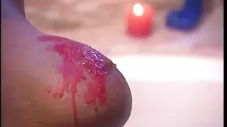 Curly haired whore enjoys when the dude spill wax on her big tits and gets aroused