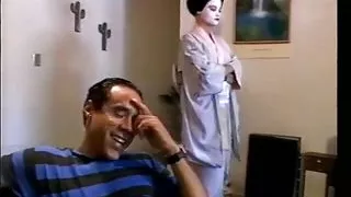 Hot ass geisha chick gets pussy pounded by two cocks on sofa