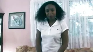 Cute girl with nice tits and big ass fingering her black pussy on a couch