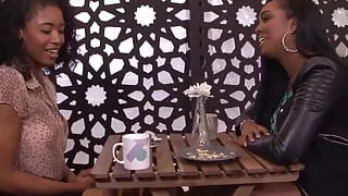 Busty ebony girls like to have gentle lesbian sex with a big blue dildo on the couch