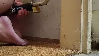 Anal chastity buttplug chained to the radiator with ice lock