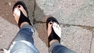 I tempt you with my sexy feet while walking on the street