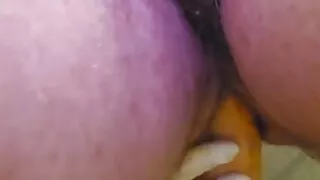 Woman puts on panty surgical gloves and inserts object into her anus