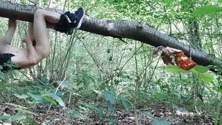 Handjob hanging from a forest tree
