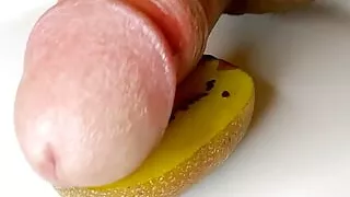 Smooth sliding on a lush wet Kiwi makes precum sweet and green on closeup