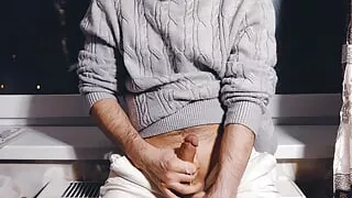 A young guy jerks off his dick and cums loudly