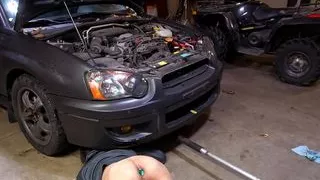 Slutty mechanic in the shop with a plug in his ass