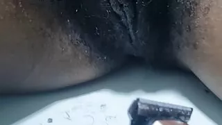 Shaving her pussy