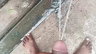 Indian cute boy showing his big cock and pissing