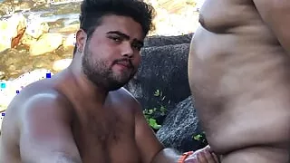 older bear takes his young gay bear to the beach to drink his milk
