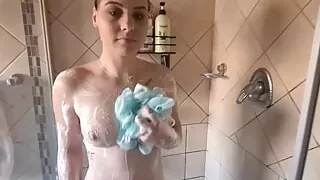 Pale girl taking a shower after playing with sex toys