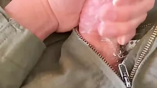 Army specialist in a flightsuit jerks off his hard cock in the office with lotion he finds