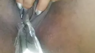 Chubby black clit holding pee while rubbing