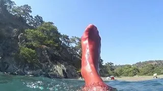red stocking in the sea at the public beach