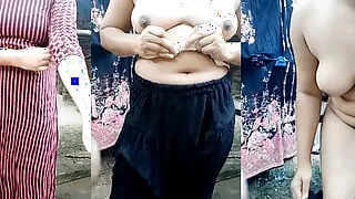 Beautiful desi cute girl's bath scene. Showering and dress changing in open village bathroom