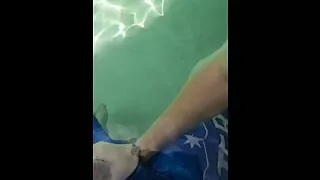 Giving the poolboy a handjob