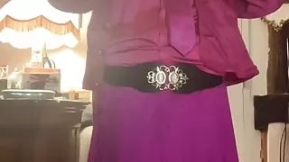 In fuchsia flight attendant's outfit for one evening with a mouth retractor