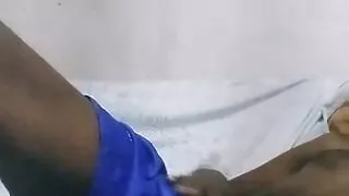 Handsome male playing with his hard dick at the sofa