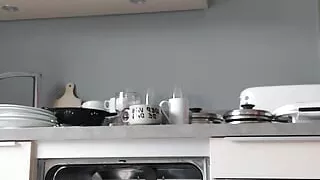 Grandad empties the dishwasher