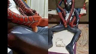 Spiderman and Venom give each other a footjob from behind