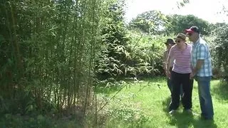 Nudist Brunette Has Group Sex Outdoors