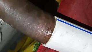 Indian boy at home having fun with conduit pipe and cumming inside it