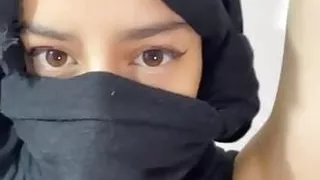 Arab with her face covered dancing arabian dance sensual form