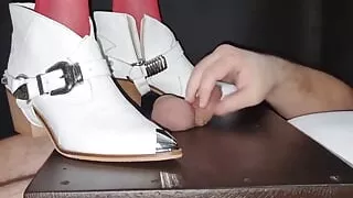 White Boots Ball Crushing and Ball Standing on the Ballcrushing Table