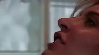 A Sexy Blonde Girl with Huge Fake Juggs Watches Another Blonde with Big Fake Boobs