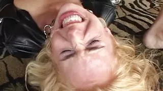 A blonde in stockings gets double penetrated while a big cock is in her mouth