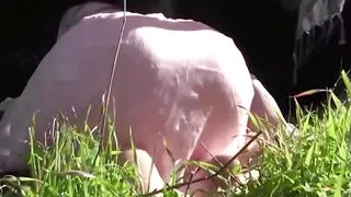Two busty brunettes enjoy playing with each other in nature