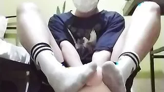 Cute Twink Misha showing his dirty socks and playing with piggy by his feet