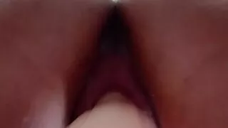 Young slut fucks her creamy pink pussy